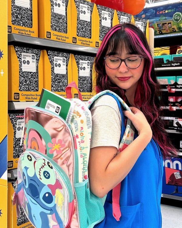 Girl with backpack full of supplies