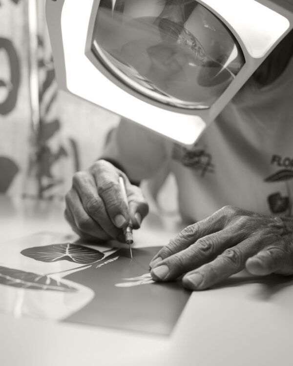 Designer working with magnifying glass