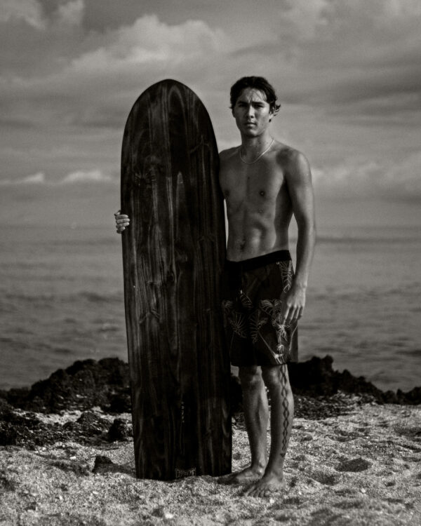 Surfer with board on shore