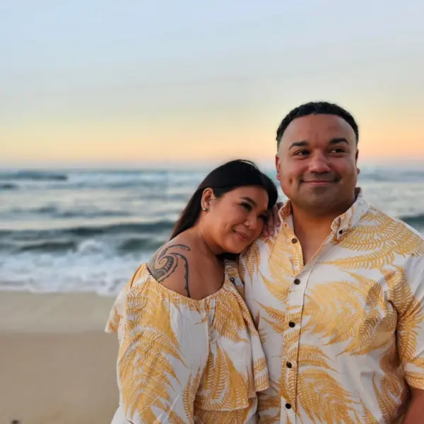 Couple with gold and white matching outfits